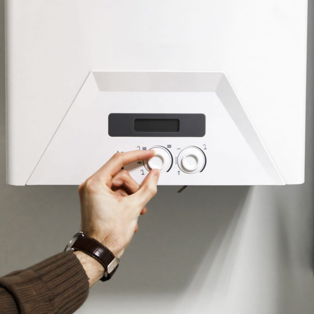 man-regulate-heating-boiler-control-panel