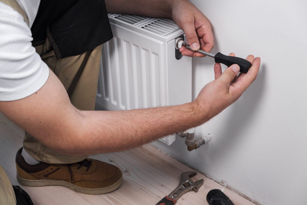 plumber-installing-new-steel-hot-water-central